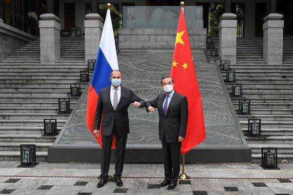 Sergey V. Lavrov, left, and Wang Yi, the Russian and Chinese foreign ministers, in Guilin, China, last week. They urged the United States to â€œreflect on the damage it has done.â€