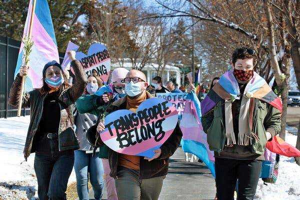 People protesting this month outside the governorâ€™s mansion in Pierre, S.D. They were marching against a bill that would bar transgender girls and women from participating in sports leagues.