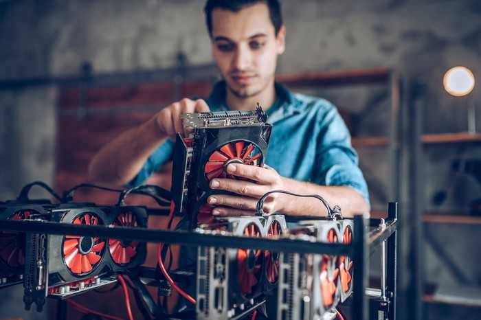 A man sets up a cryptocurrency mining platform.